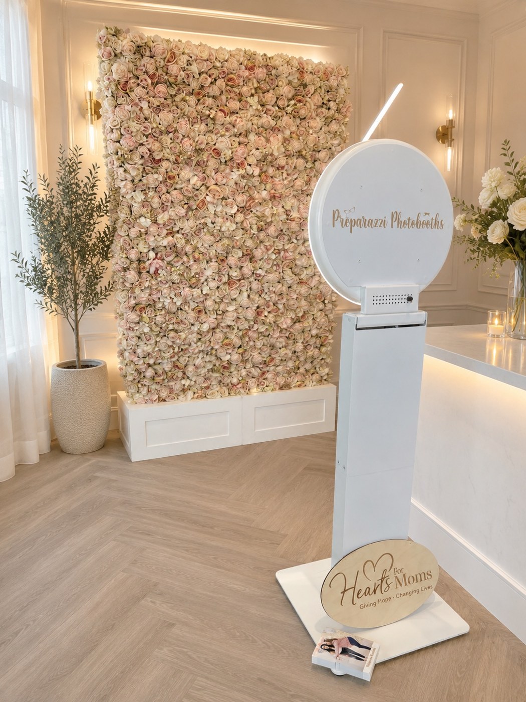 Selfie station with a floral backdrop